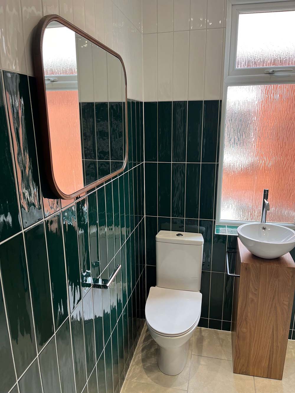 Bathroom installation, toilet and sink, green tiles, by Morris-Last plumbing and heating services, Rossendale