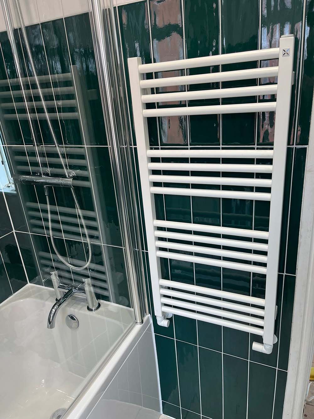 Bath and radiator, green tiles, bathroom installation by Morris-Last plumbing and heating services, Rossendale